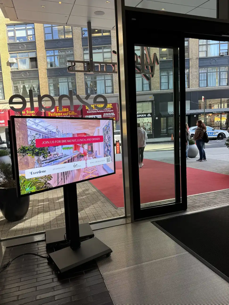 Small business digital signage: a freestanding screen at the Exhale Spa entrance